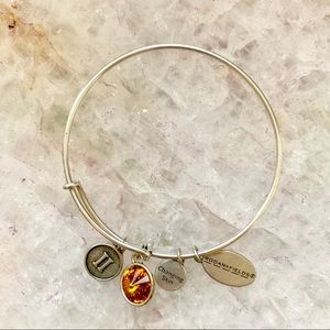 RODAN & FIELDS LEVEL II GARNET CHARM BRACELET